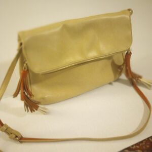 - Flip down shoulder bag with tassels